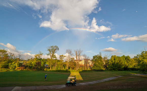 A rainbow over a golf course